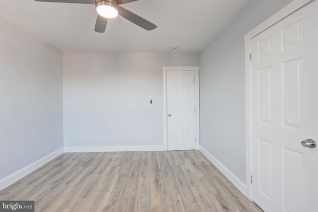 unfurnished room featuring ceiling fan and light wood-type flooring