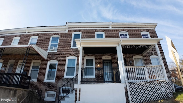 townhome / multi-family property with covered porch