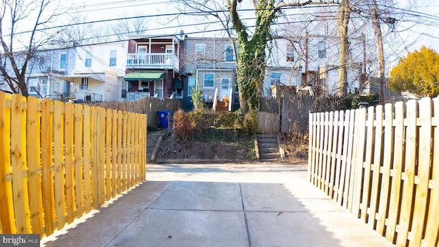 view of gate featuring a patio area