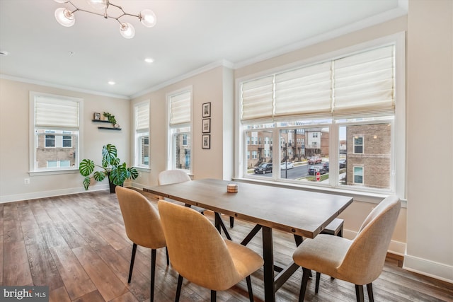 dining room featuring crown molding and wood-type flooring