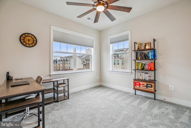 carpeted office with ceiling fan