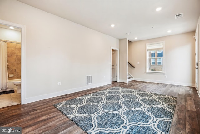 living room with dark hardwood / wood-style flooring