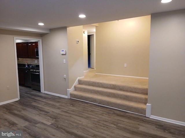 staircase featuring hardwood / wood-style flooring