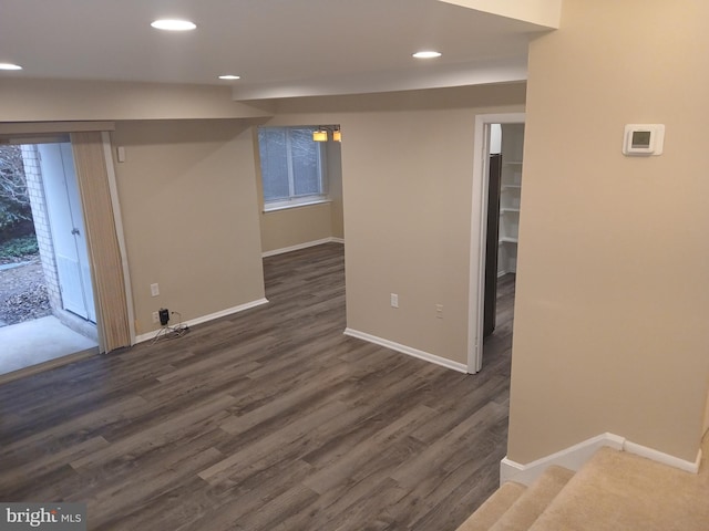 interior space featuring a healthy amount of sunlight and dark hardwood / wood-style floors