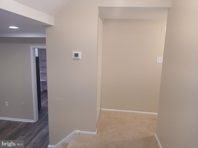 hallway with dark hardwood / wood-style floors