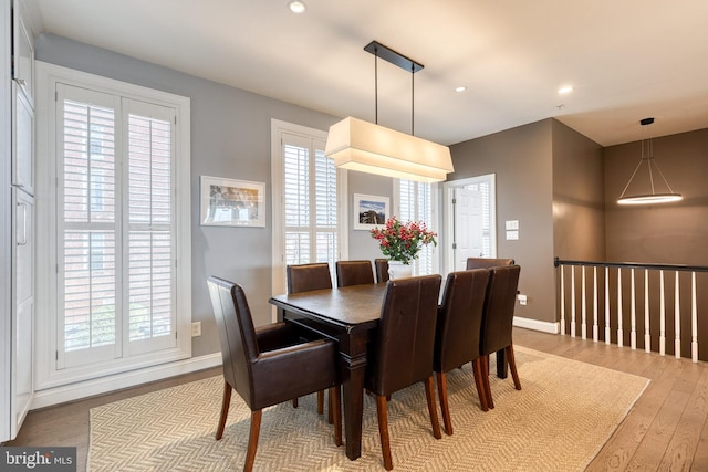 dining space with light wood-type flooring