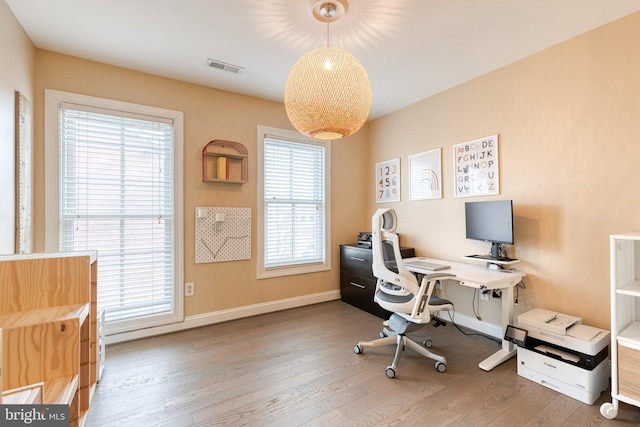 office with wood-type flooring