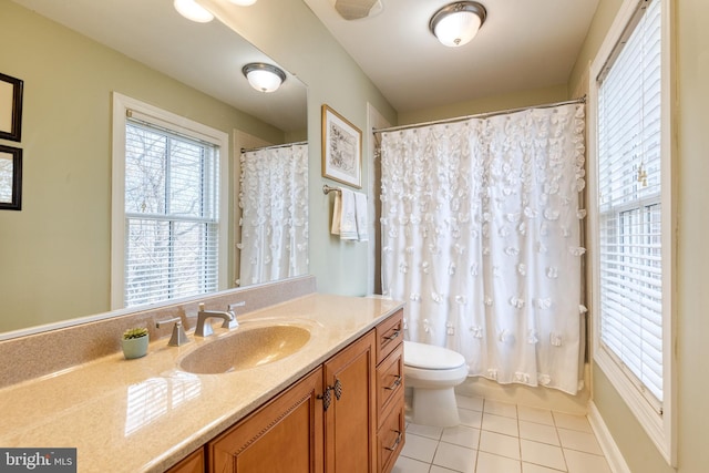 bathroom with vanity, a shower with shower curtain, tile patterned floors, and toilet