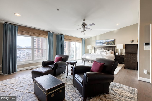 bedroom featuring vaulted ceiling, ceiling fan, and light hardwood / wood-style flooring