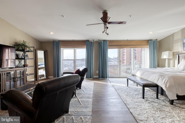 bedroom with ceiling fan, light hardwood / wood-style flooring, and access to outside