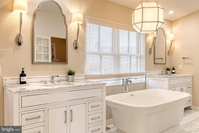 bathroom featuring vanity and a bathing tub