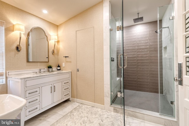 bathroom featuring vanity and an enclosed shower