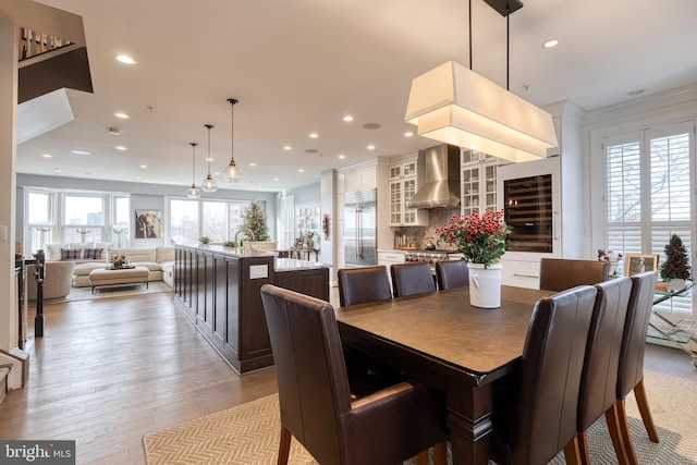 dining room featuring plenty of natural light and light hardwood / wood-style floors