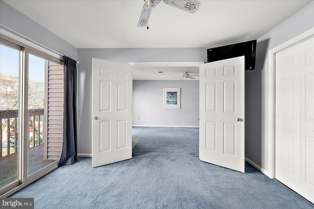 carpeted empty room with ceiling fan