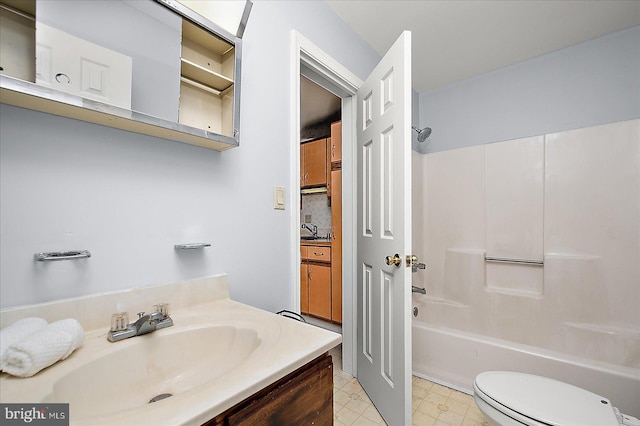 full bathroom with vanity, tub / shower combination, and toilet