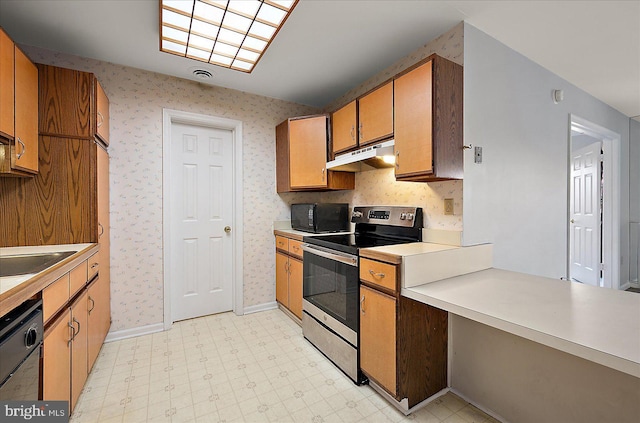 kitchen featuring black appliances and sink