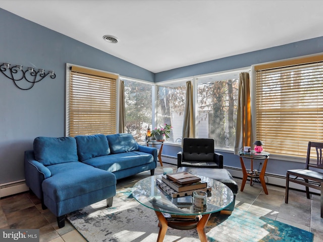 living room featuring vaulted ceiling, tile patterned flooring, and a baseboard radiator