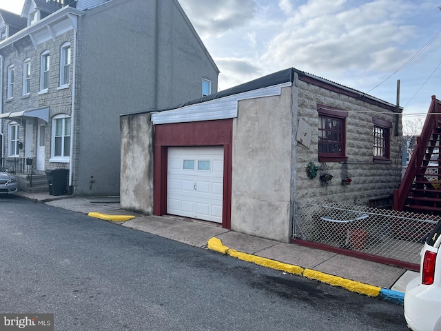 view of property exterior featuring a garage