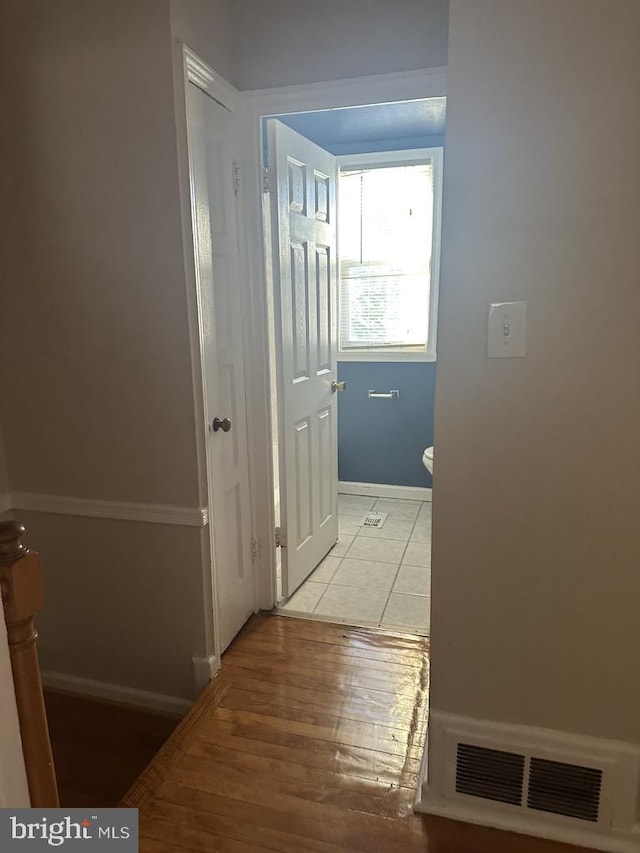 hallway with light tile patterned floors