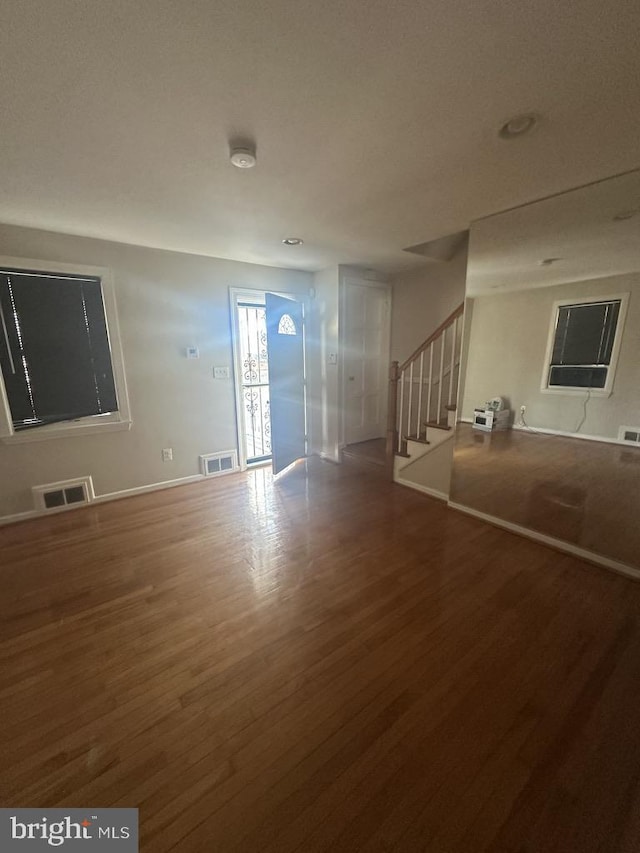 empty room with hardwood / wood-style flooring