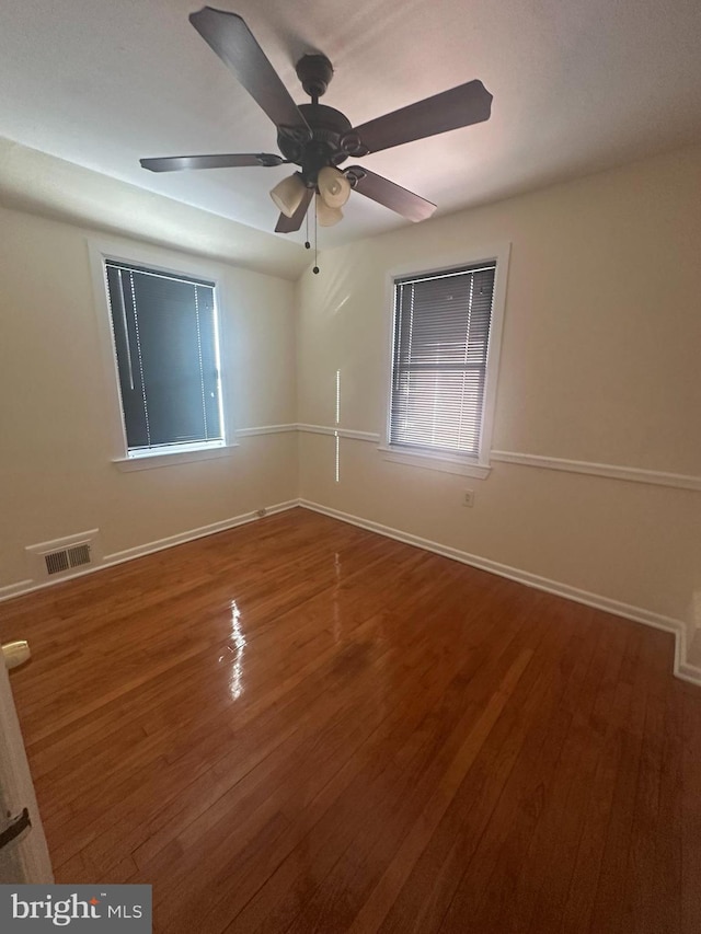 empty room featuring ceiling fan and wood-type flooring