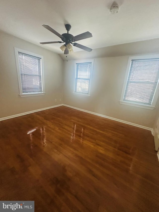 empty room featuring ceiling fan and hardwood / wood-style floors