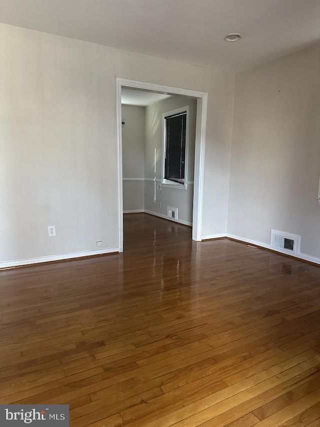 empty room featuring dark hardwood / wood-style floors