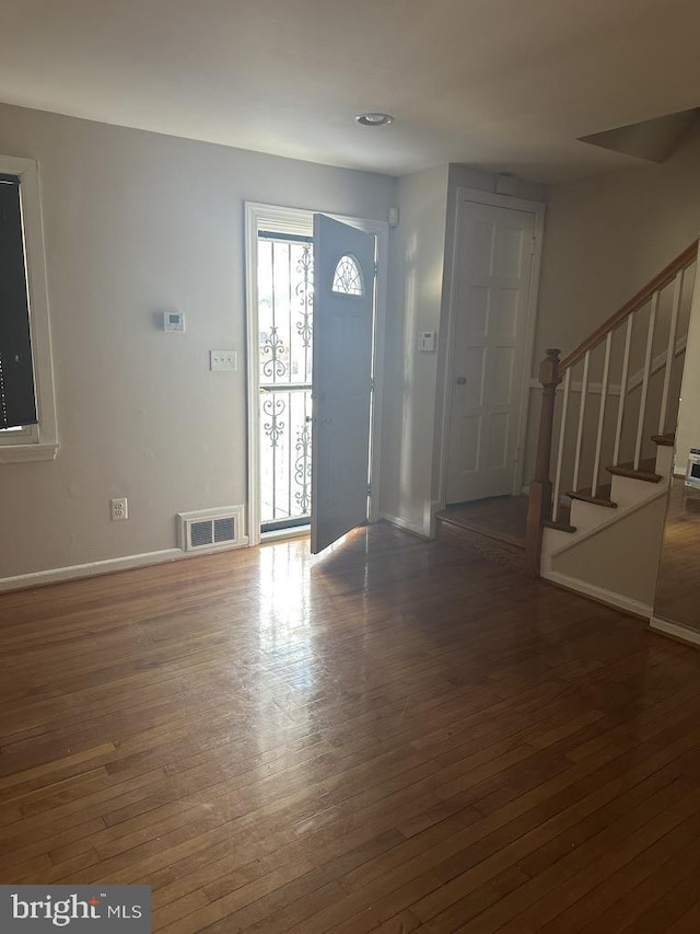 entryway featuring dark wood-type flooring