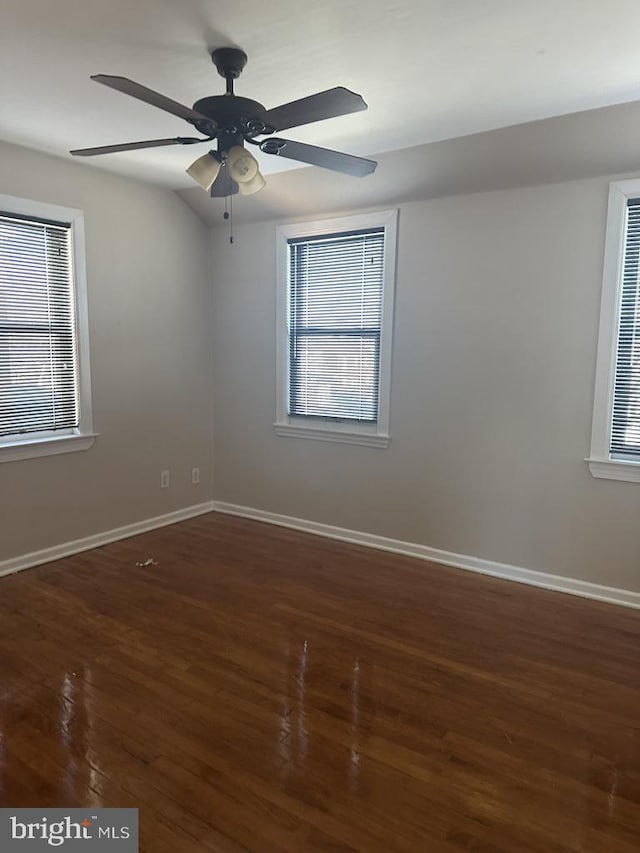 spare room featuring dark hardwood / wood-style floors and ceiling fan