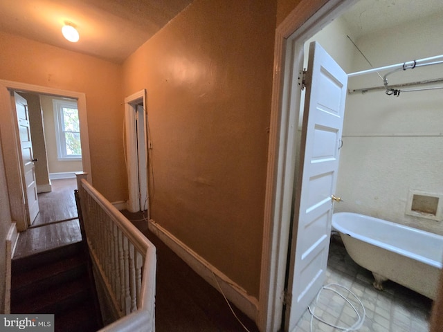 corridor with wood-type flooring