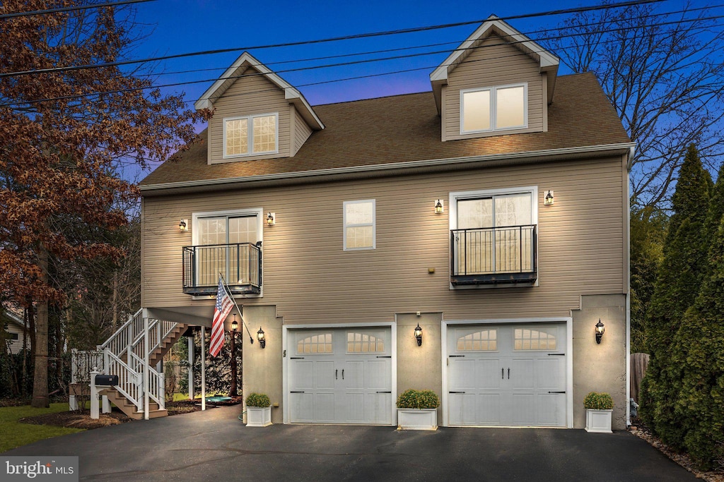 view of front of house with a balcony and a garage