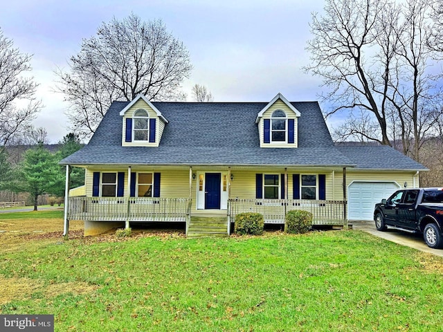 new england style home featuring a front lawn, a porch, and a garage