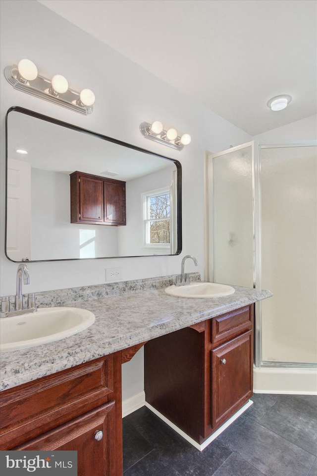 bathroom featuring vanity and an enclosed shower