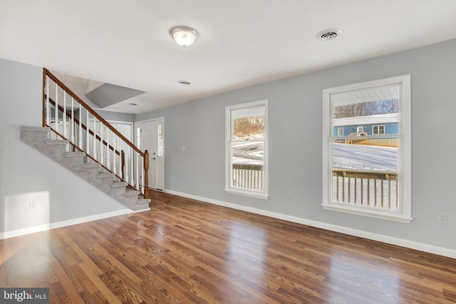 foyer featuring hardwood / wood-style flooring and a healthy amount of sunlight