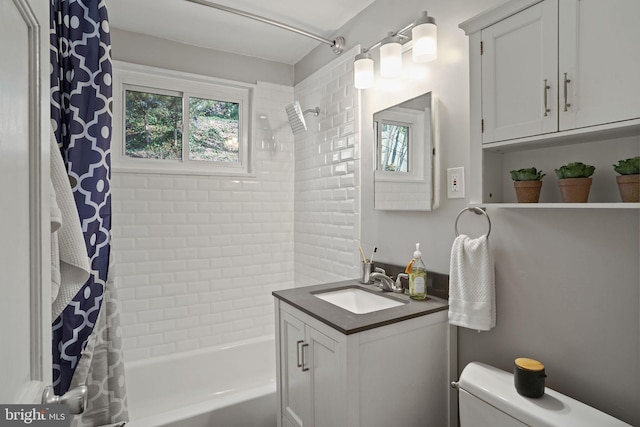 full bathroom featuring vanity, shower / tub combo, and toilet