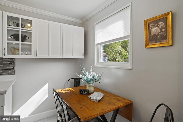 dining area featuring ornamental molding