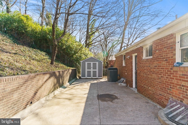 view of patio featuring central AC and a storage unit