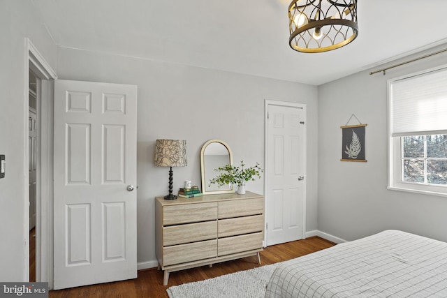 bedroom featuring dark hardwood / wood-style flooring