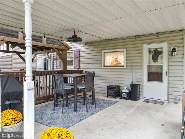 view of patio with area for grilling and ceiling fan