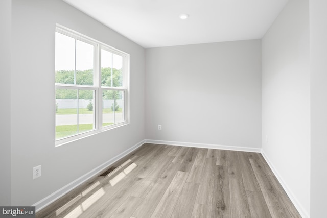 unfurnished room featuring light hardwood / wood-style flooring