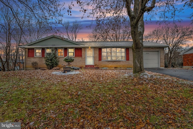 single story home with a garage