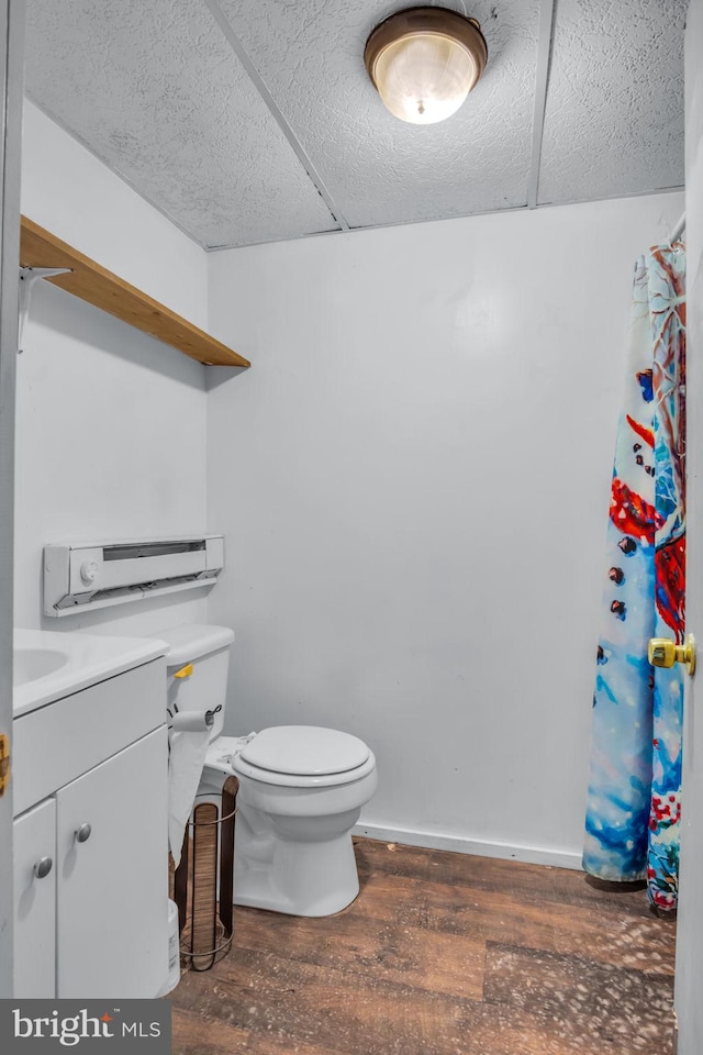 bathroom featuring hardwood / wood-style floors, vanity, and toilet