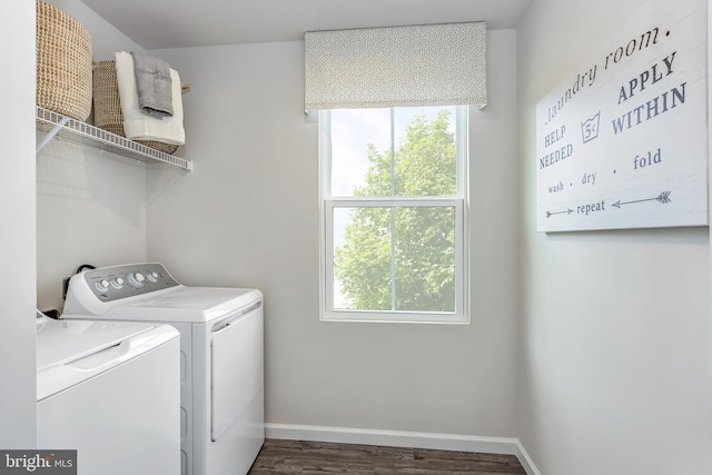 laundry room with washing machine and dryer and dark hardwood / wood-style floors