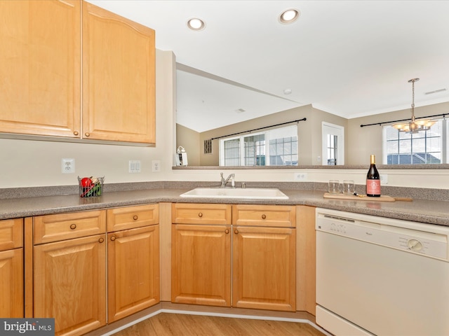 kitchen with sink, a notable chandelier, white dishwasher, light hardwood / wood-style floors, and decorative light fixtures