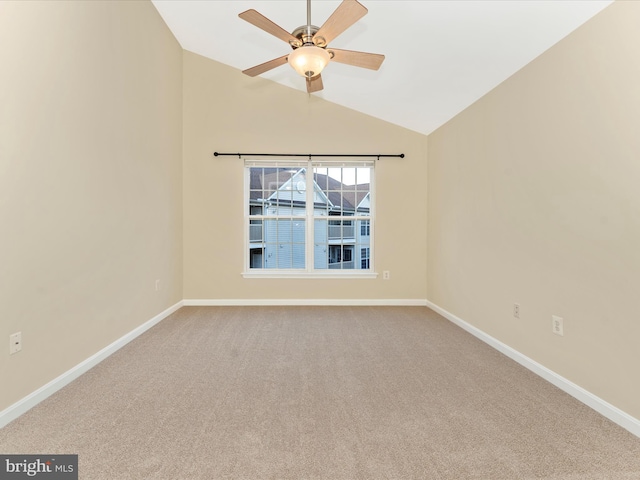 spare room with ceiling fan, carpet floors, and lofted ceiling