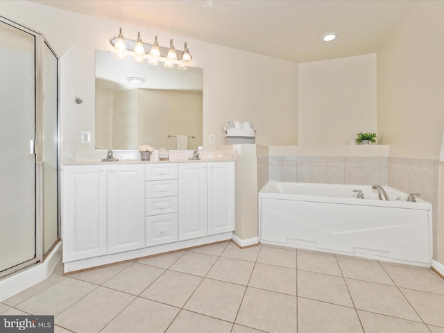 bathroom featuring a washtub, vanity, and tile patterned floors