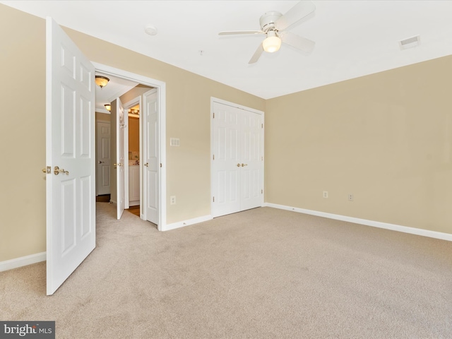 unfurnished bedroom with light carpet and ceiling fan