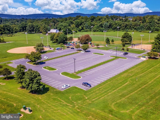 birds eye view of property with a mountain view