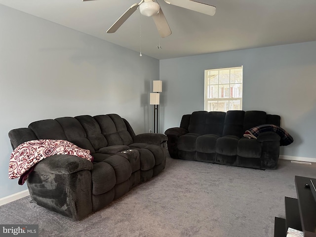 living room with ceiling fan and light carpet