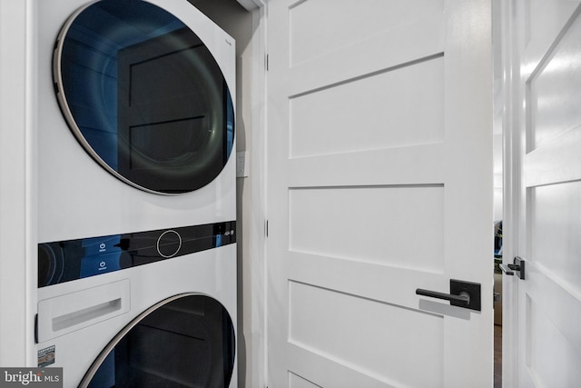 clothes washing area with stacked washer / drying machine